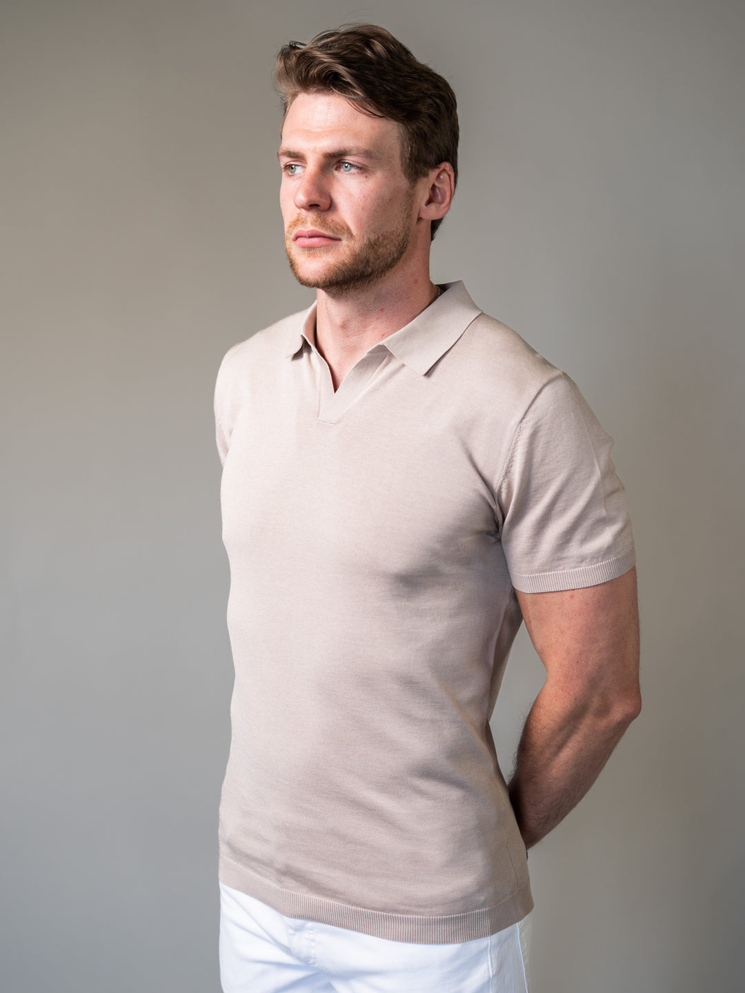 Light brown muscle fit knitted polo engineered for broad shoulders and narrow waist