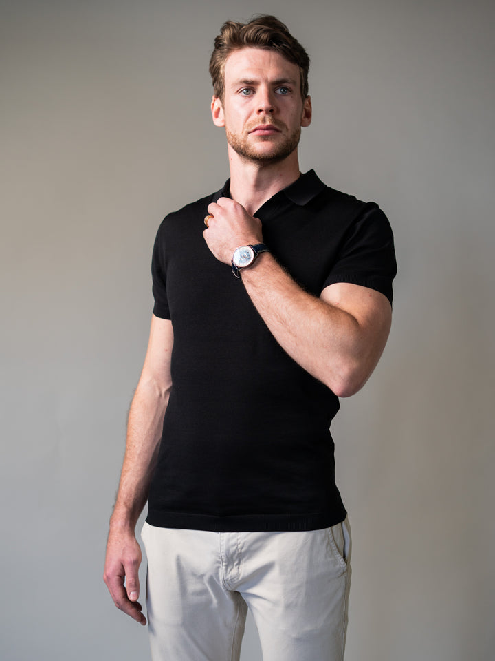 Men’s black knit polo shirt with revere collar designed for a sculpted silhouette